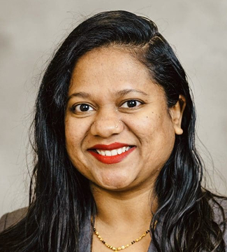 Preeti Jagadev, a female professor, smiling at the camera.