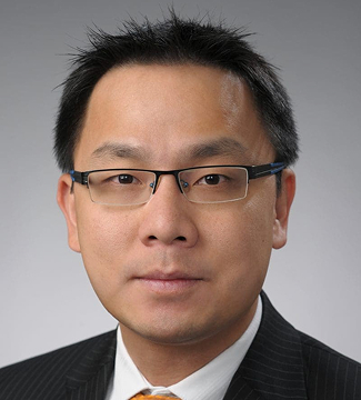 Ying Lin, a male professor, looking at the camera.